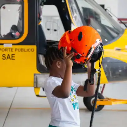 yellow helicopter and child with a red helmet