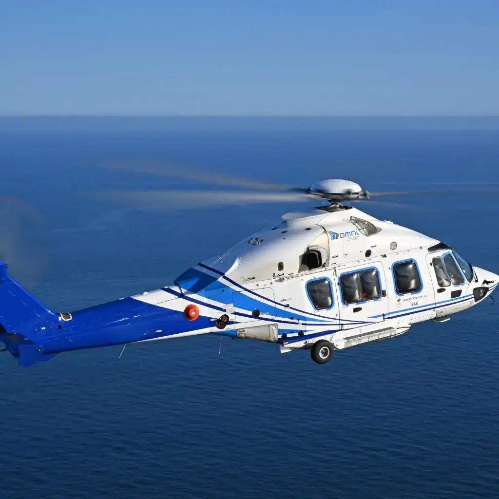 Helicopter flying over ocean