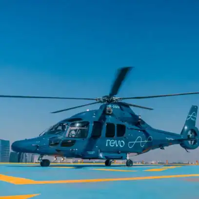 grey helicopter in blue background