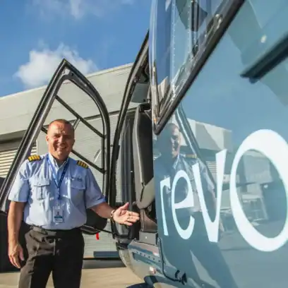 Helicopter pilot next to helicopter