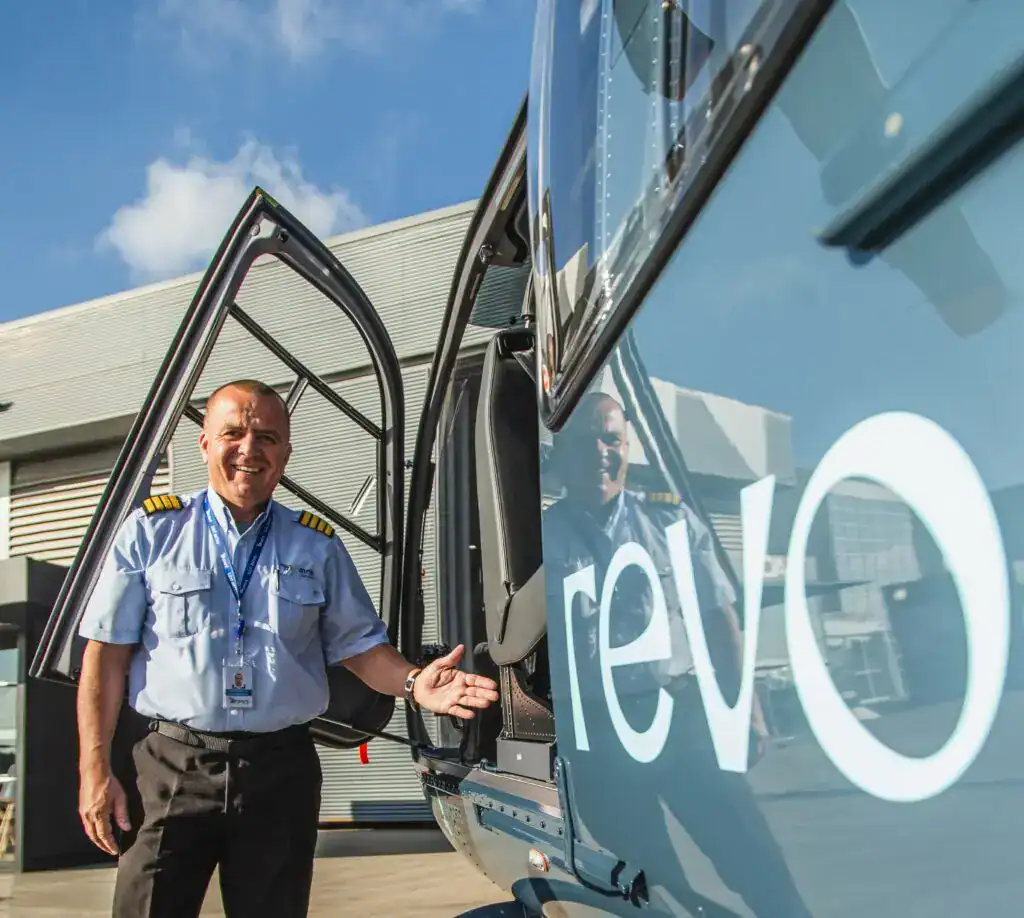 Helicopter pilot next to helicopter